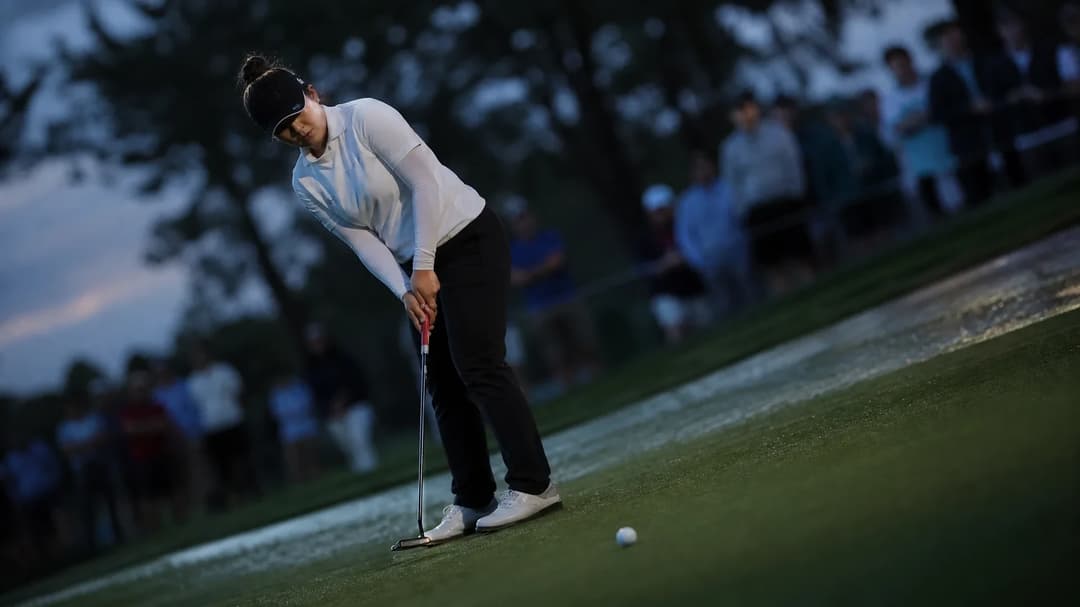 Sei Young Kim preparing to putt at TPC Boston during twilight.
