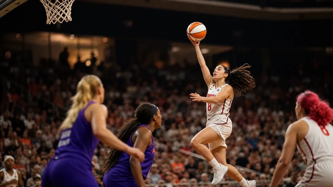 Georgia Amoore executing a jump shot in a basketball game.