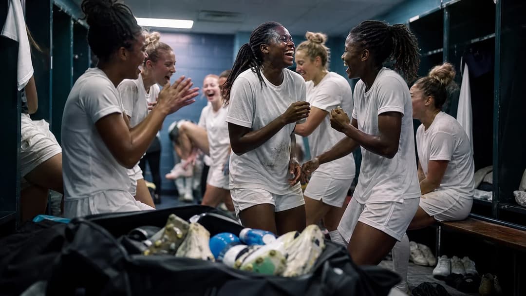 A group of Washington Spirit players celebrating in the locker room after a match.