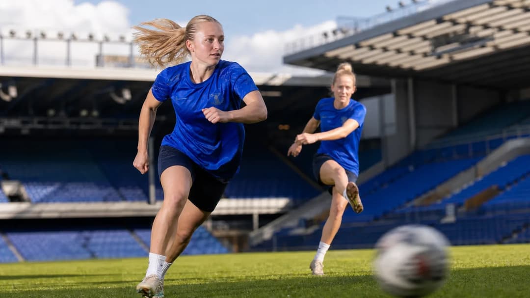 Holly McNamara sprinting past Jutta Rantala during a training session at Goodison Park.
