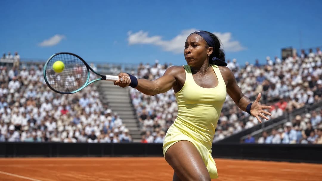 Coco Gauff striking a forehand during a tennis match at Flushing Meadows.