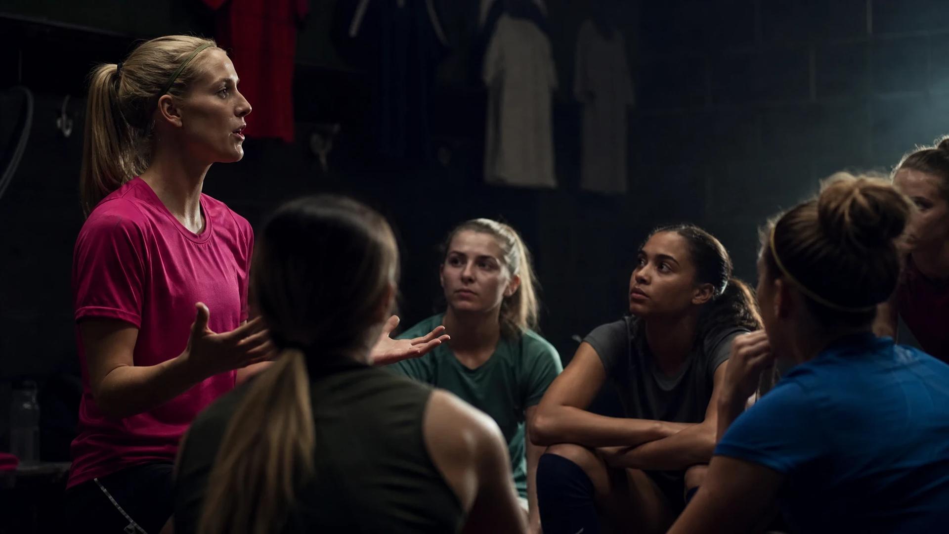 Kyra Spitzner and her teammates engaged in a strategic discussion during training.