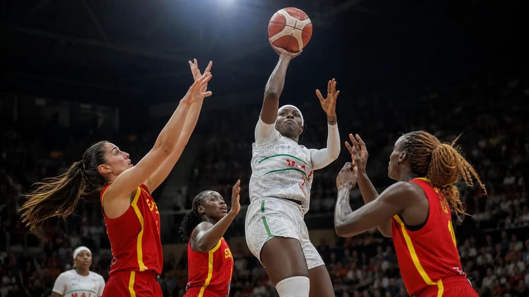 Sika Kone mid-jump during a basketball game.