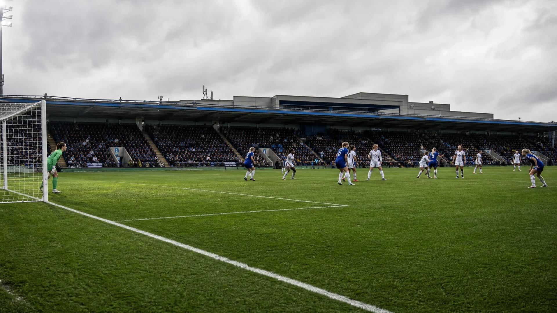A wide shot of Stamford Bridge during the Women's Super League match, capturing players in action.