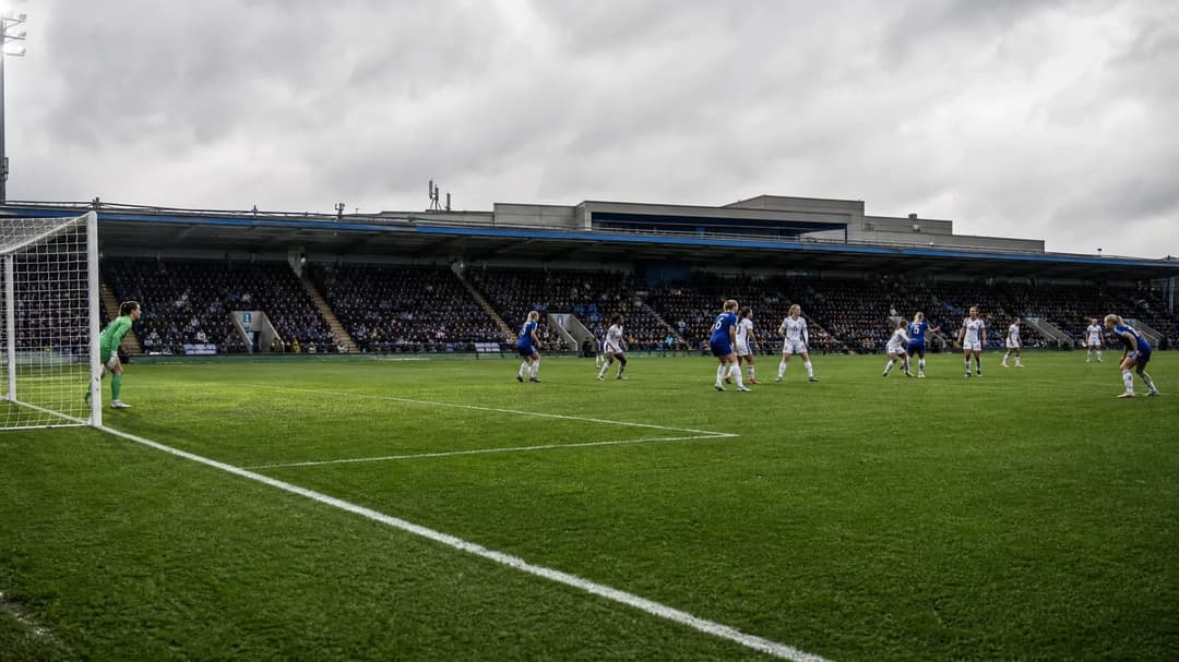 A wide shot of Stamford Bridge during the Women's Super League match, capturing players in action.
