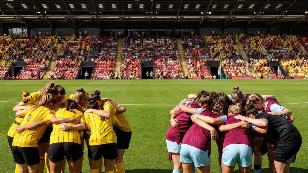 A wide shot of the Vicarage Road stadium filled with fans, capturing a huddle of players from Watford and Burnley in the foreground.
