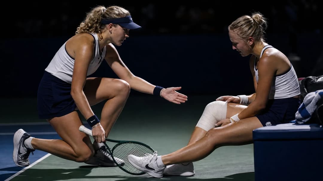 Mirra Andreeva offers assistance to Anastasia Potapova after an injury during their match at the US Open