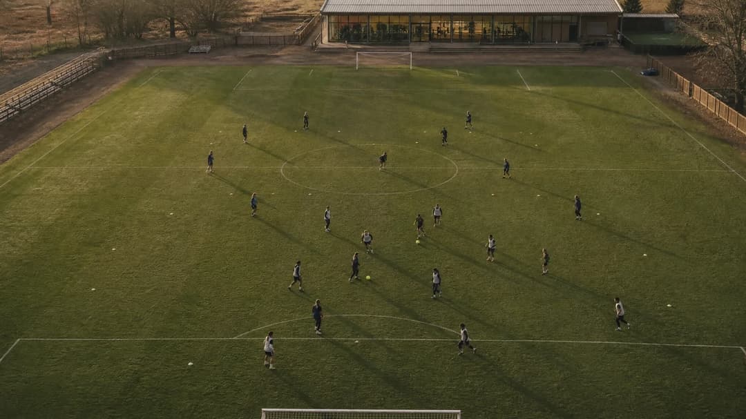Aerial view of women training at London City Lionesses' facility.