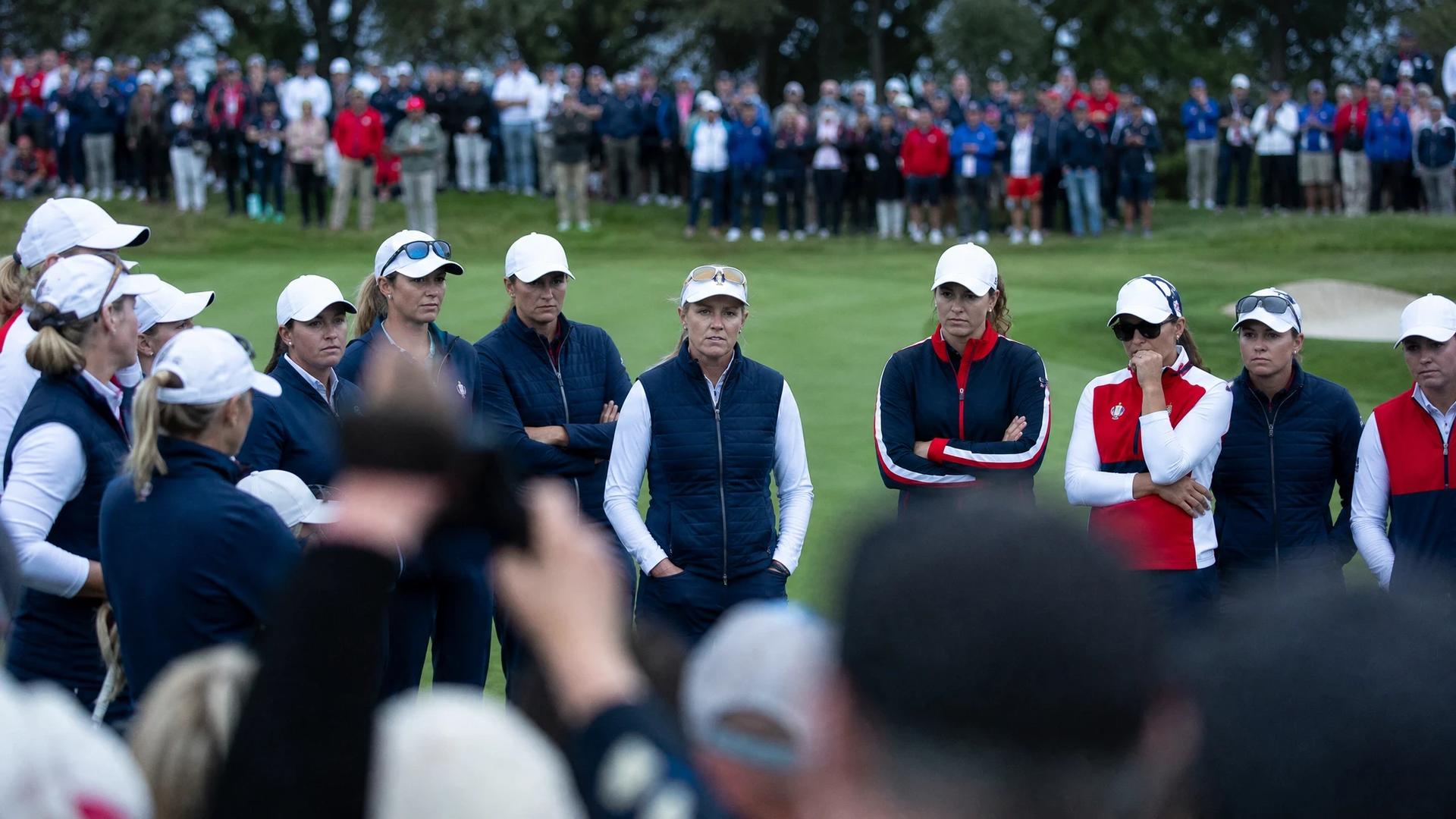Angela Stanford stands confidently at Bernardus Golf with her team, surrounded by an excited crowd.