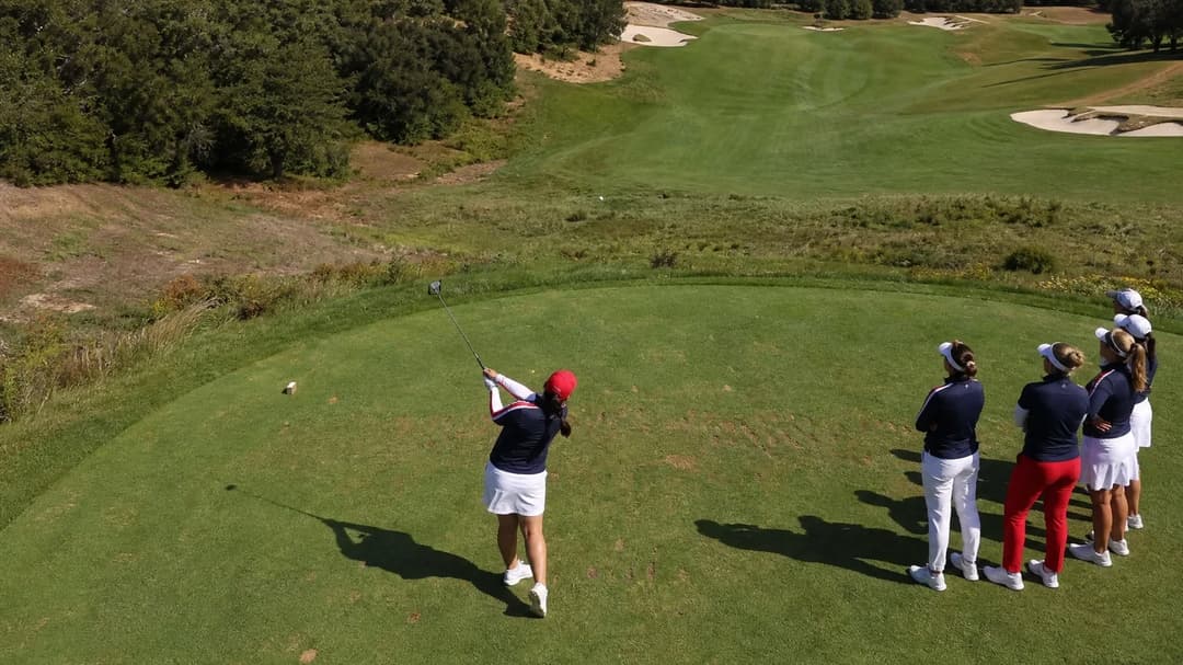 Aerial view of Angel Yin preparing to tee off at Bernardus Golf, with teammates in the background.