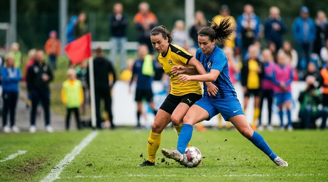 Two female football players engaging in a competitive moment on the pitch.