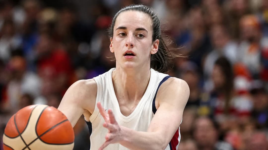 Caitlin Clark intensely focused during a basketball match in Berlin.