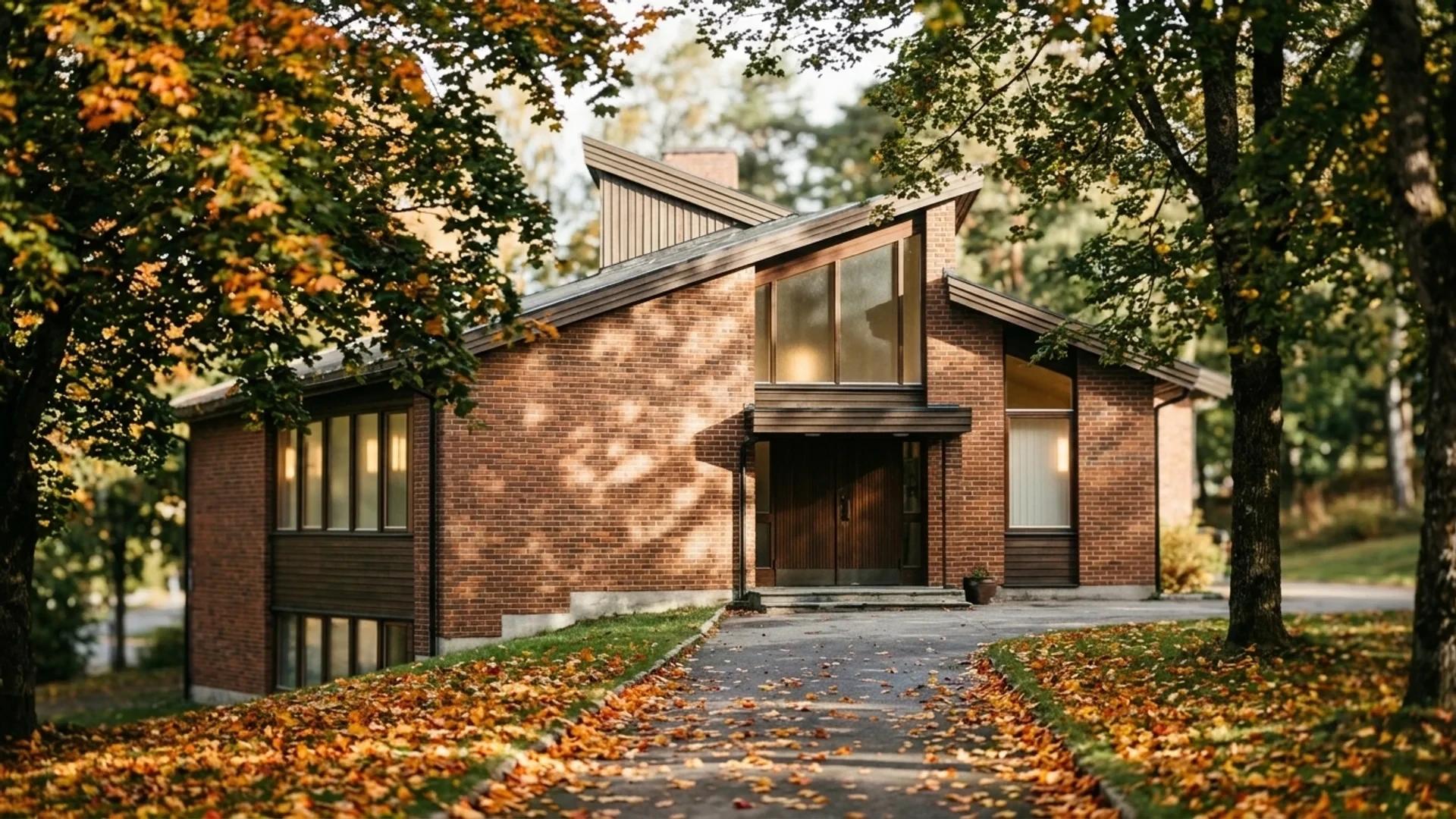 Nanset menighet's church building in Larvik surrounded by autumn foliage.