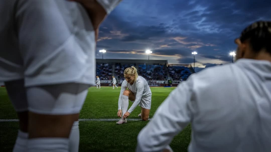 Ada Hegerberg prepares on the sidelines at Groupama Stadium.