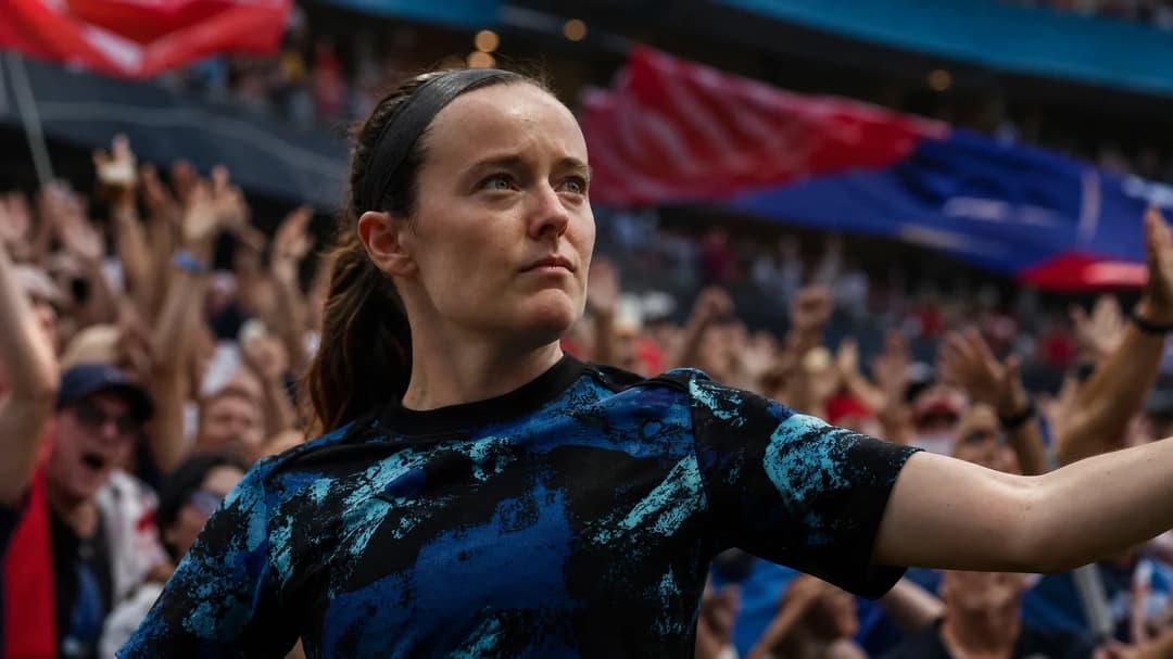 Rose Lavelle stands confidently in a sports arena, celebrating amidst a vibrant crowd of fans.
