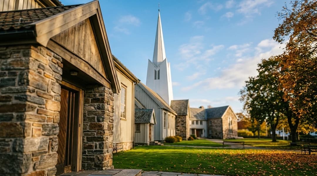 A close-up view of the stone facade of Larvik church under a bright sky.